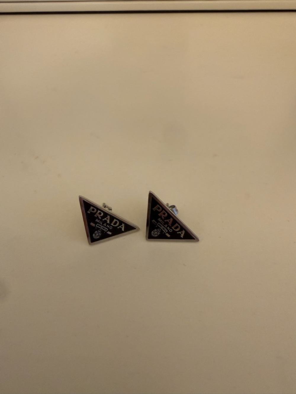 Black and Silver Triangle Logo earrings